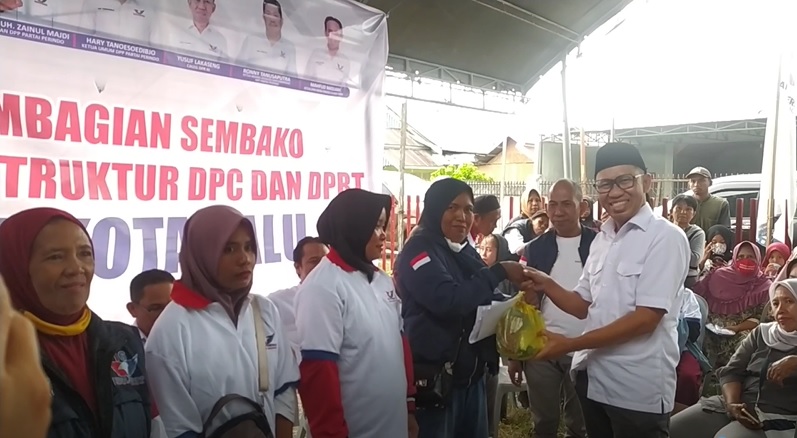 Partai Perindo Sulteng Bagikan Sembako dan KTA Berasuransi